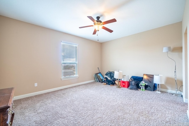 rec room with ceiling fan and carpet