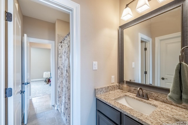 bathroom with vanity, tile patterned flooring, and a shower with curtain