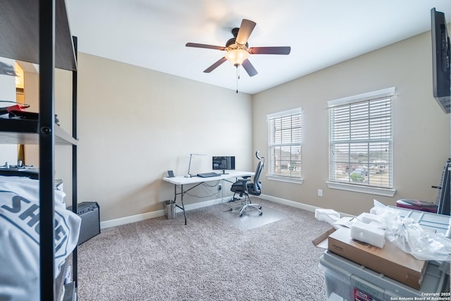 carpeted office featuring ceiling fan