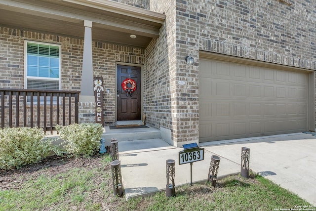 property entrance with a garage