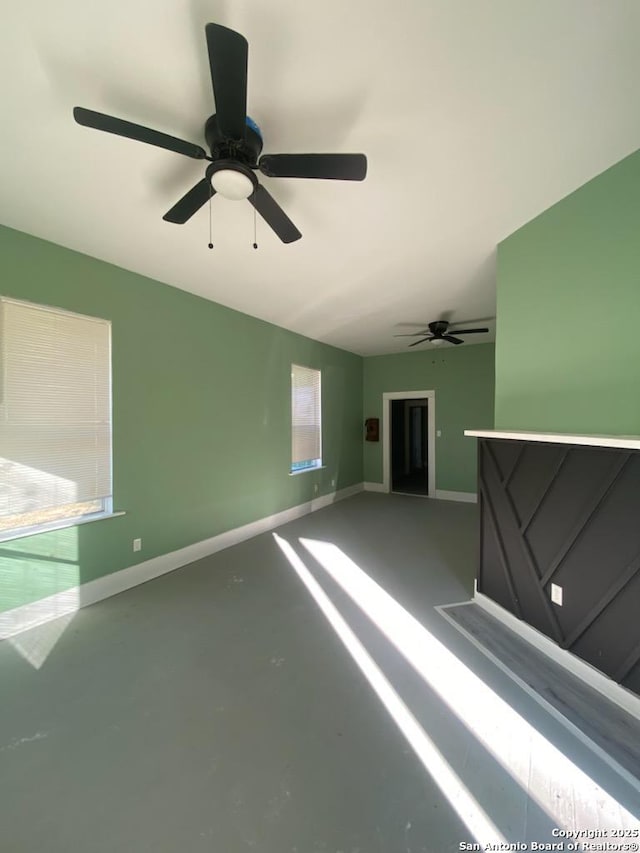 unfurnished room with concrete flooring