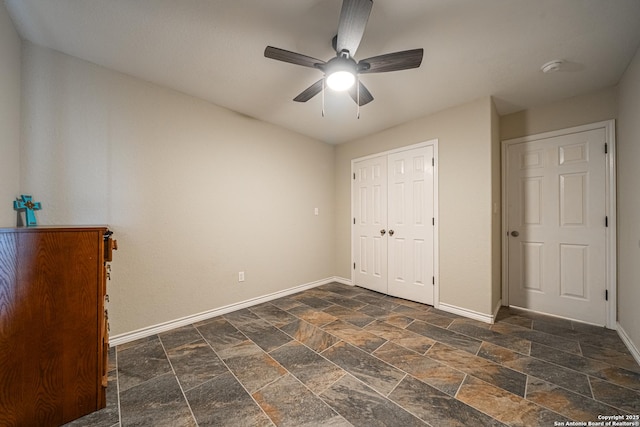 unfurnished bedroom with a closet and ceiling fan