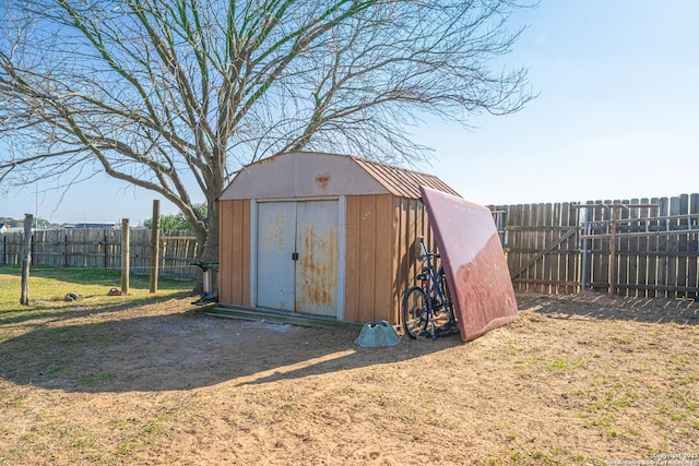 view of outbuilding featuring a yard