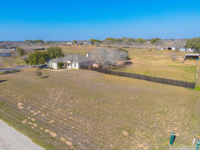 birds eye view of property with a rural view