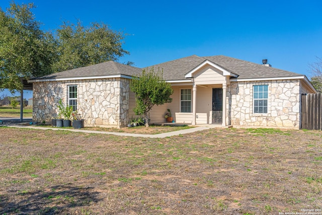 ranch-style home featuring a front yard