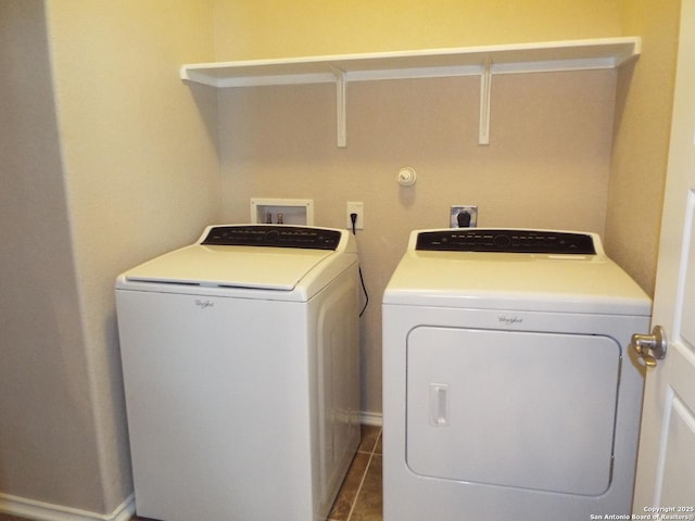 laundry area with tile patterned flooring and washer and clothes dryer