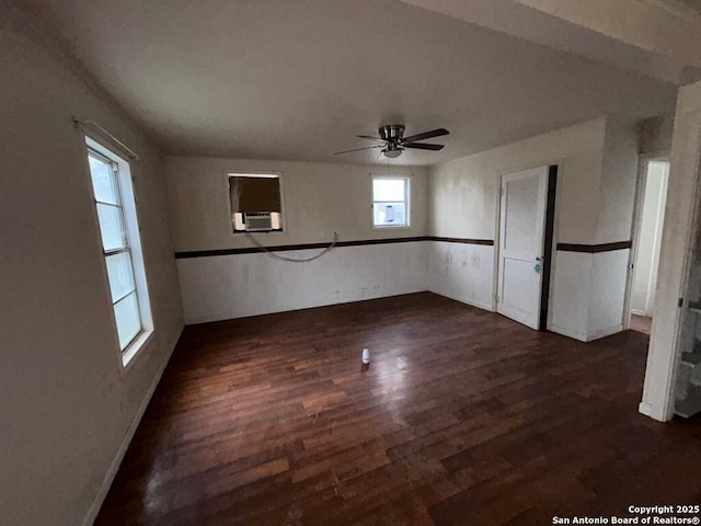 unfurnished room with ceiling fan and dark hardwood / wood-style flooring