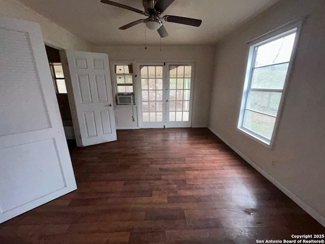 unfurnished room with cooling unit, dark wood-type flooring, french doors, and ceiling fan