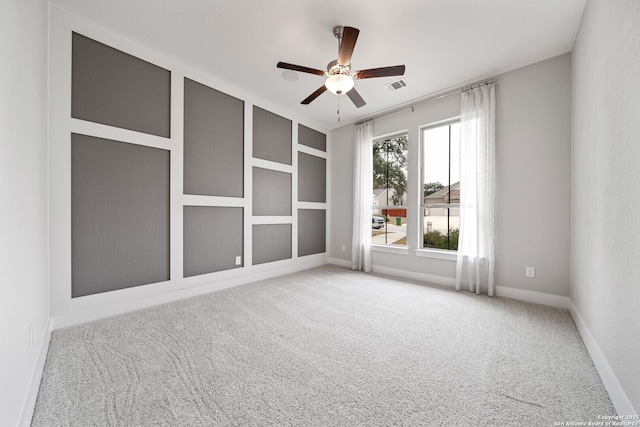 unfurnished room with carpet floors and ceiling fan