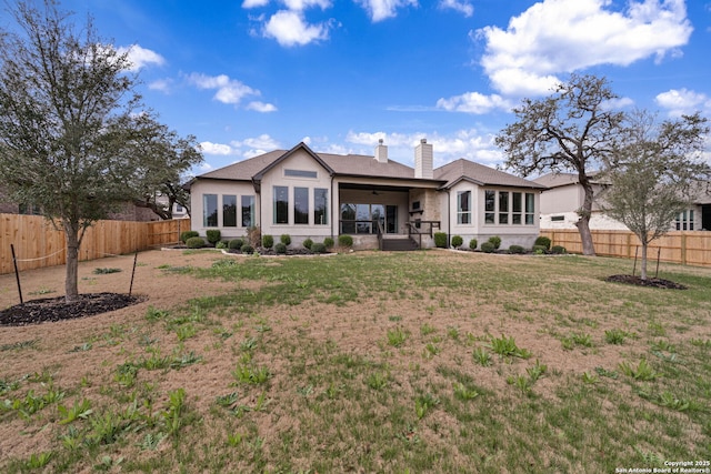 back of house with a yard