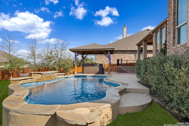 view of swimming pool with a fenced in pool, a fenced backyard, a hot tub, and a gazebo