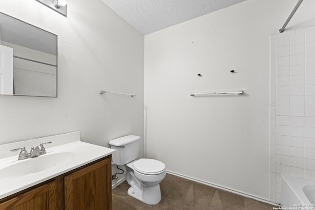 full bathroom featuring vanity, toilet, shower / bathing tub combination, and a textured ceiling