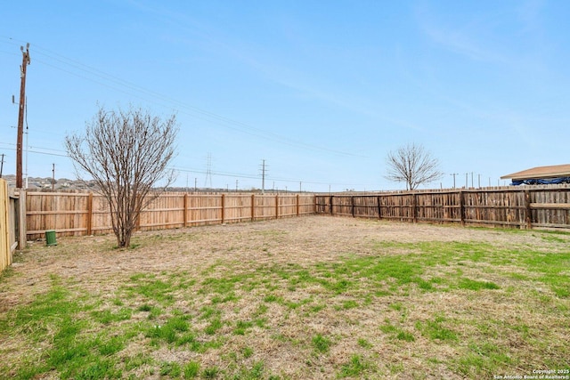 view of yard with a fenced backyard