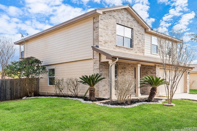 view of front of house featuring a garage and a front yard