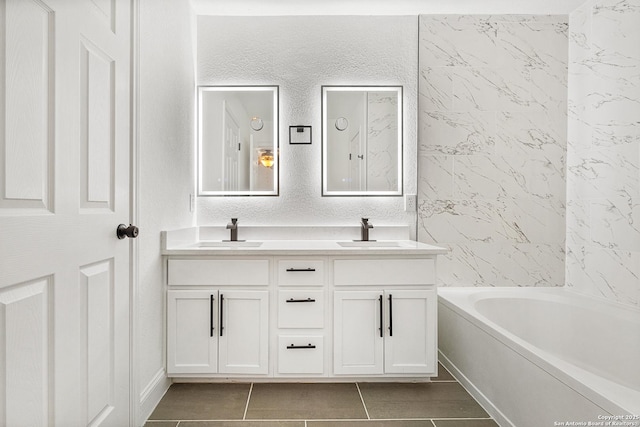 bathroom with vanity, tile patterned flooring, and shower / tub combination