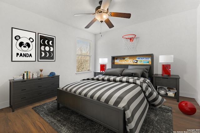 bedroom featuring ceiling fan and dark hardwood / wood-style flooring