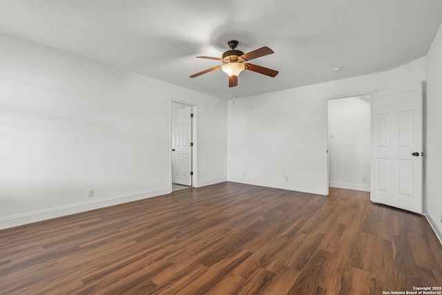 unfurnished room featuring dark hardwood / wood-style floors and ceiling fan