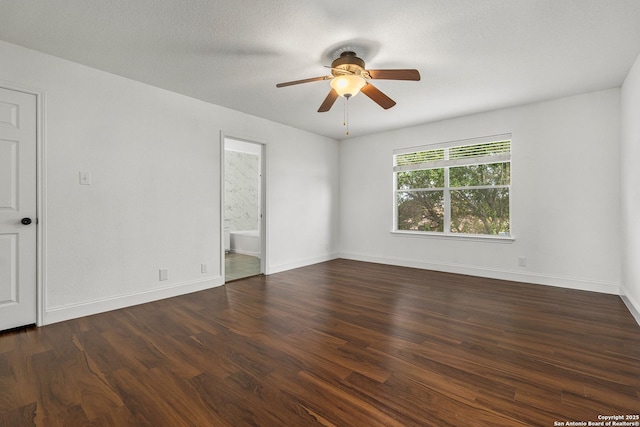 unfurnished room featuring ceiling fan and dark hardwood / wood-style floors