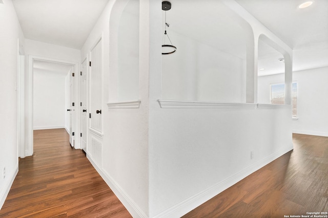 hallway featuring dark wood-type flooring