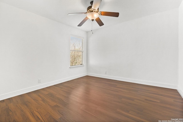 empty room with dark wood-type flooring and ceiling fan