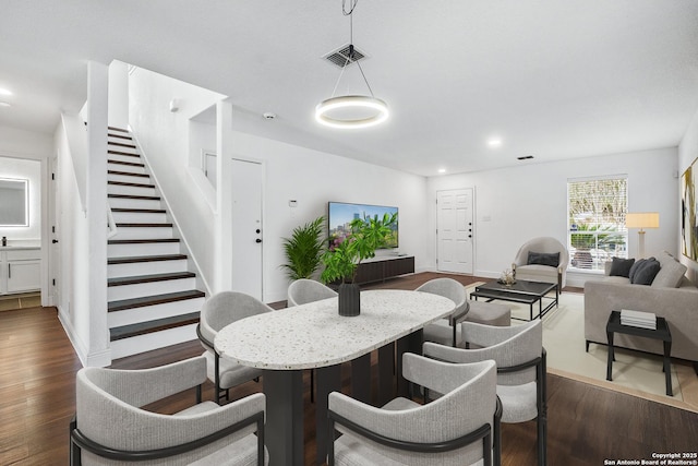 dining room with dark wood-type flooring