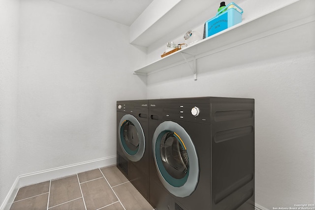 laundry room with washing machine and clothes dryer