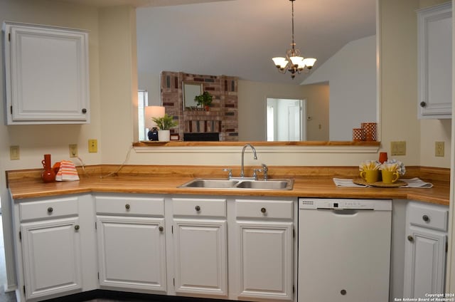 kitchen with sink, white cabinetry, hanging light fixtures, white dishwasher, and kitchen peninsula