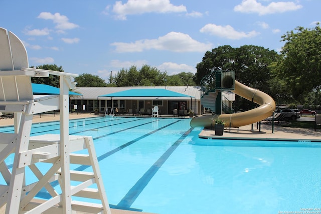 view of pool with a water slide