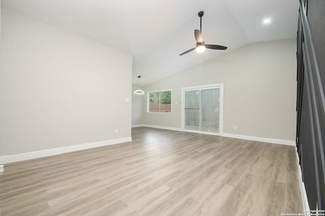 unfurnished living room with lofted ceiling, ceiling fan, and light hardwood / wood-style flooring