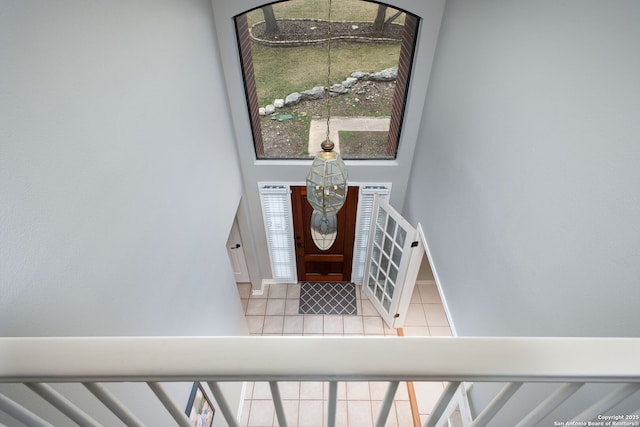 entryway with tile patterned flooring and a wealth of natural light