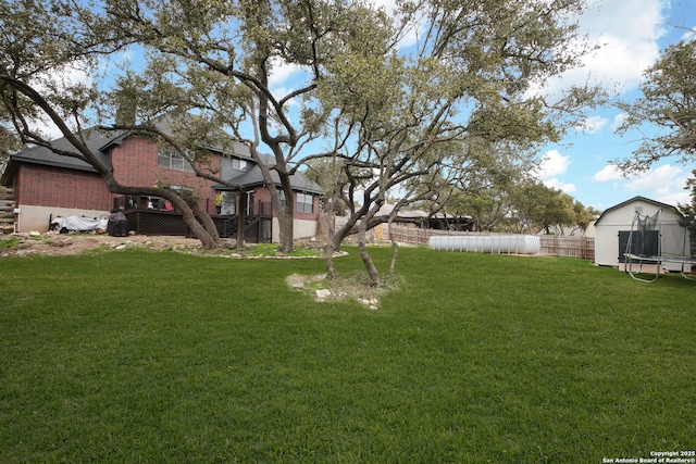 view of yard with a trampoline