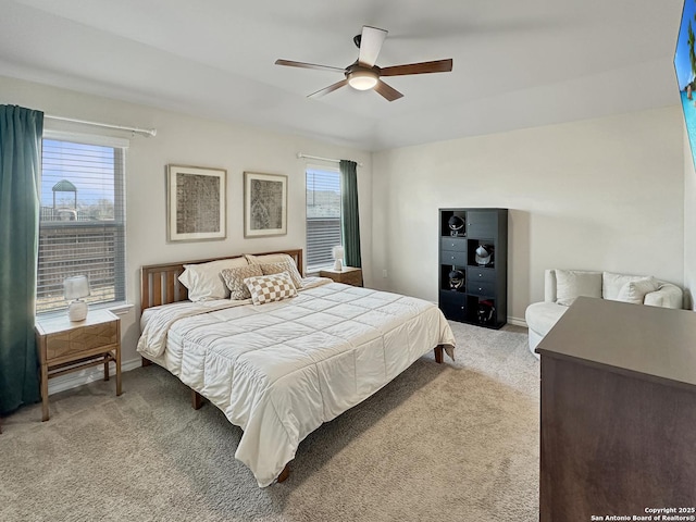 carpeted bedroom featuring ceiling fan