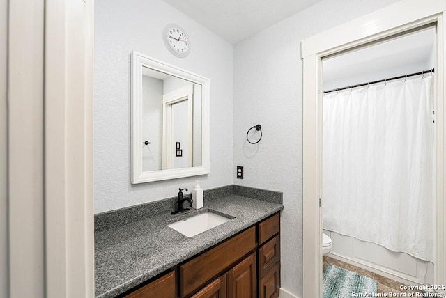 full bathroom featuring vanity, shower / tub combo with curtain, and toilet