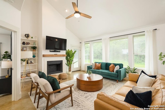 living room featuring high vaulted ceiling and ceiling fan