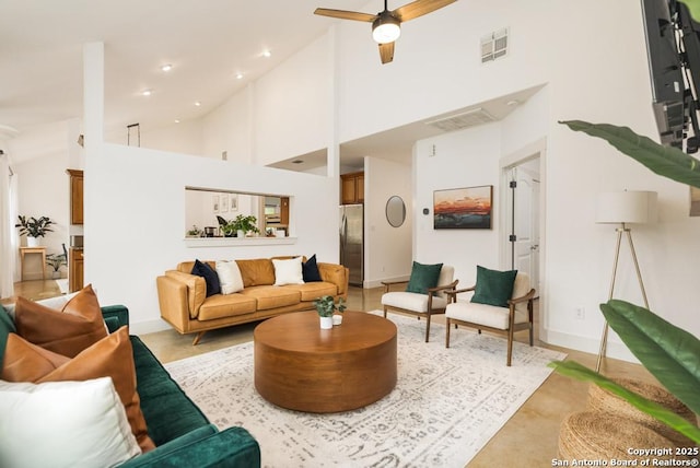 living room with high vaulted ceiling and ceiling fan