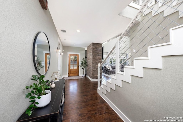 foyer entrance featuring dark hardwood / wood-style floors