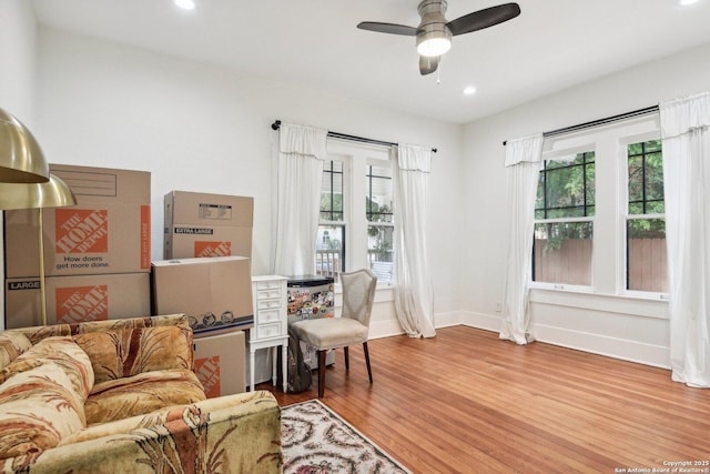 interior space with hardwood / wood-style floors, a wealth of natural light, and ceiling fan