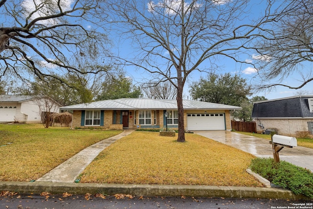 ranch-style house with a garage and a front yard