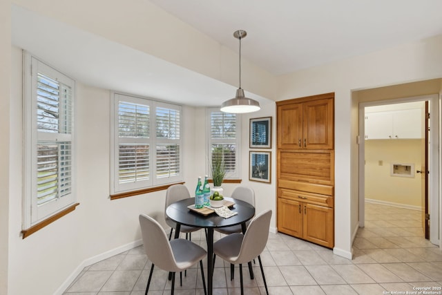 dining area featuring light tile patterned floors