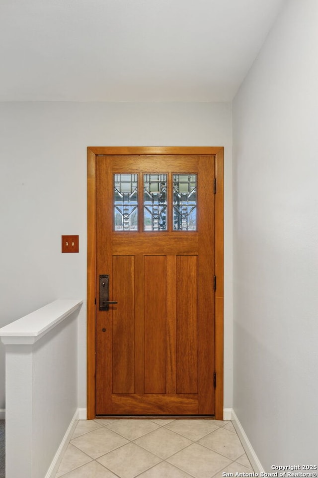 foyer featuring light tile patterned floors