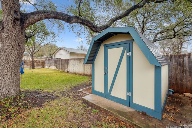 view of outbuilding with a lawn