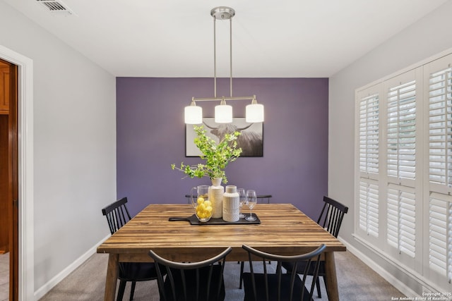 view of carpeted dining area