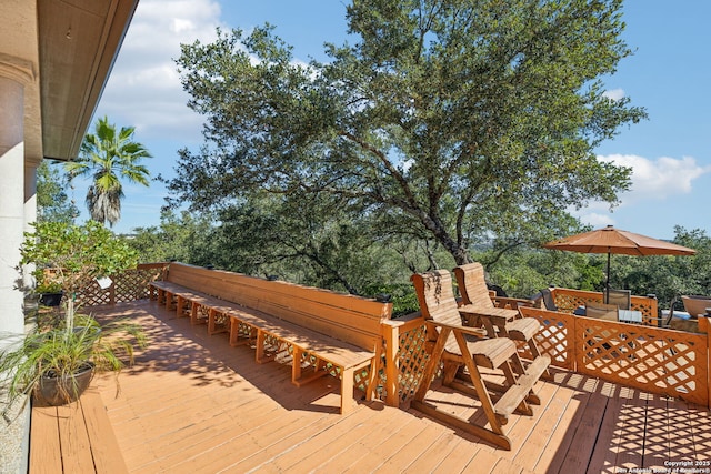 wooden terrace featuring a bar