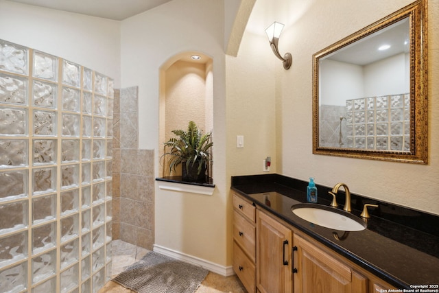 bathroom with vanity and walk in shower