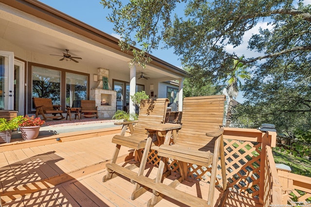 wooden terrace featuring ceiling fan