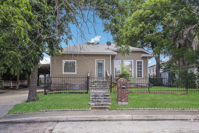 bungalow-style home with a carport and a front yard