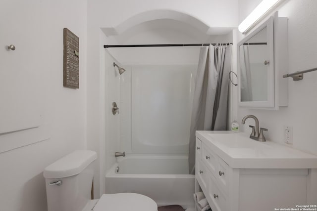 full bathroom with vanity, shower / bath combo, and toilet