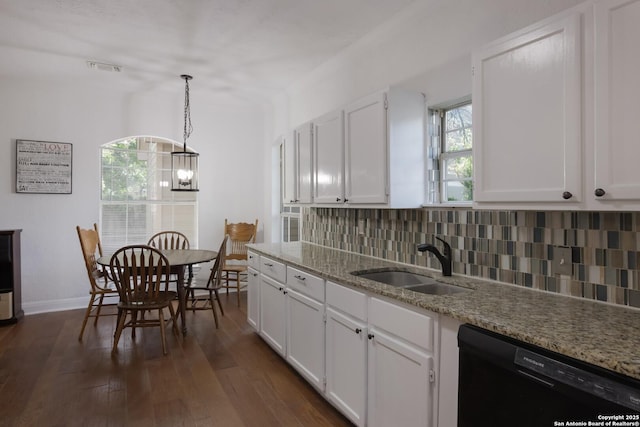 kitchen with pendant lighting, sink, dishwasher, light stone counters, and white cabinets