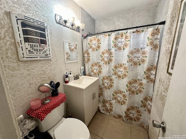 bathroom with vanity, toilet, tile patterned floors, a textured ceiling, and a shower with shower curtain