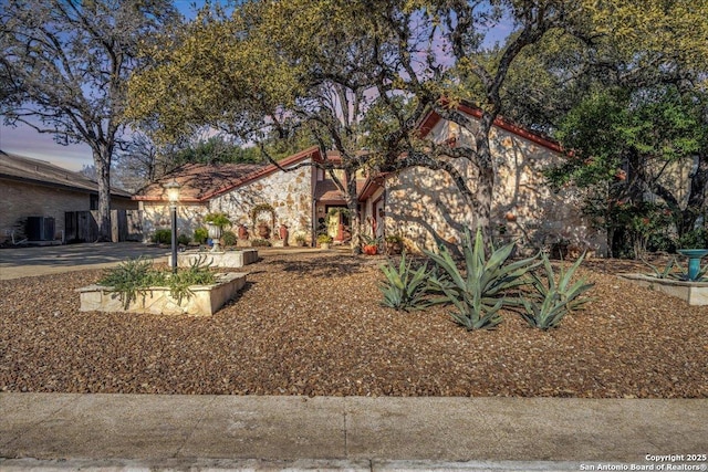 view of front of property featuring cooling unit